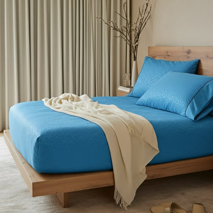 Sábanas Floréa Petróleo sobre cama SOFT NATURE